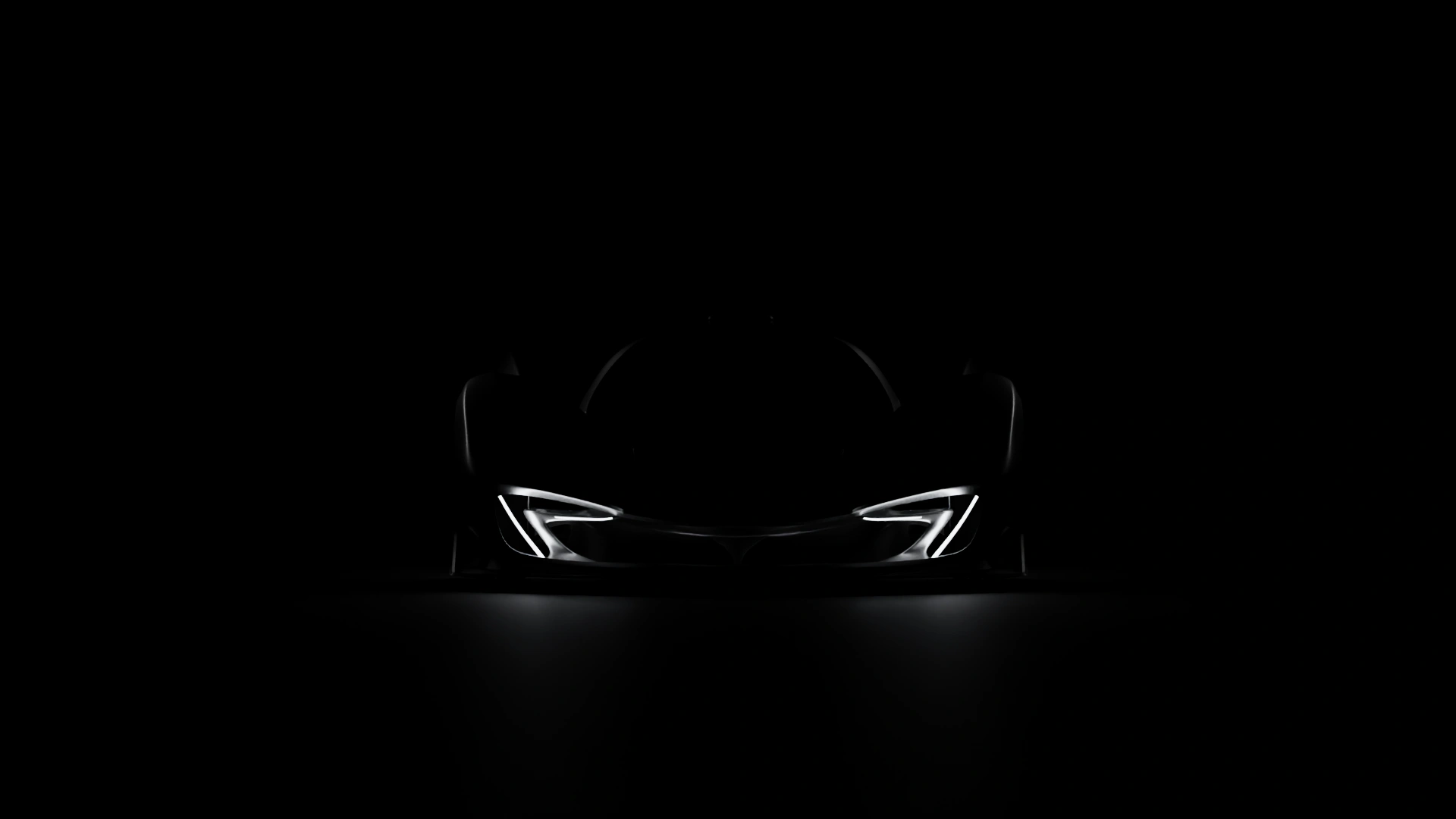 McLaren Z1 in darkness, symmetrical front view with illuminated daytime running lights